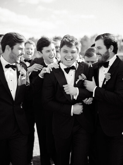 Black and white photo of groom and his groomsmen