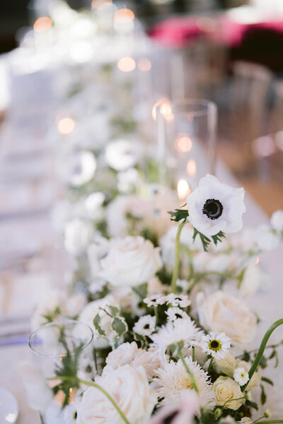 A bride holds her summer wildflower bouquet prior to her Aspen wedding ceremony