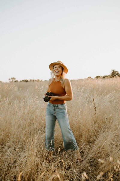 CA photographer laughing with camera
