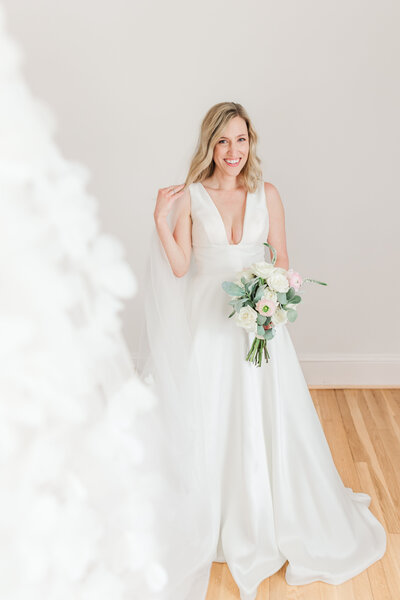 a bride in her wedding dress posing for portraits