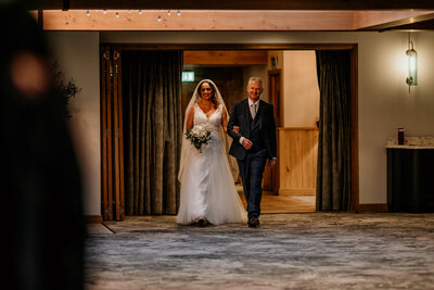 Bride and father on wedding day at peak edge hotel
