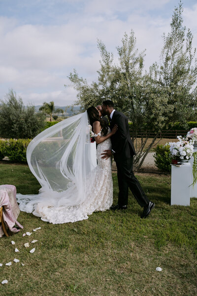 Chase kissing his bride, Keiyana, at their wedding ceremony in Temecula California. Click the image to see more photos from their wedding day.