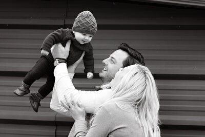 Couple holding newborn during portrait photography session
