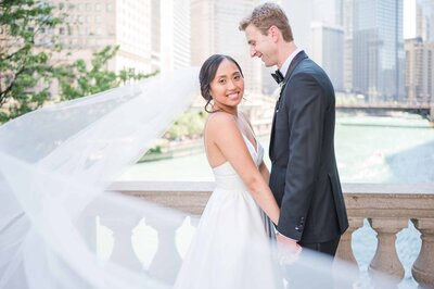 Light and airy wedding portrait outside of the Wrigley building in downtown Chicago.