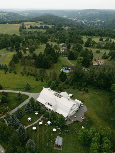 Black and white image of bride resting her head on groom's shoulder