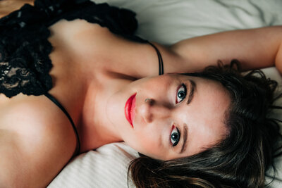 Boudoir photo Missoula woman in black lingerie looking at camera