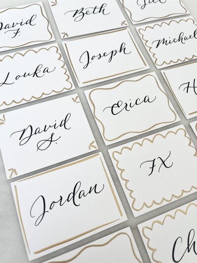 White place cards with black ink calligraphyy for Connecticut beach wedding