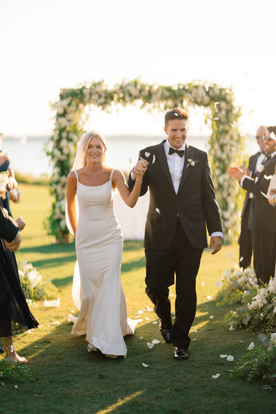 Large floral installation and couple on blue couch