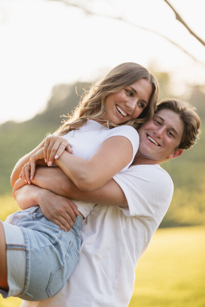 Couple kissing on for their engagements photos in a beautiful architecture. 