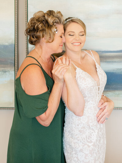 Mom and daughter sharing a special moment on the wedding day