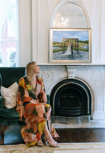 woman smiling at painting