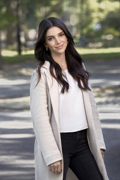 Relaxed outdoor portrait of Cat from Nushu, exuding confidence and style, captured by Ylva Erevall.
