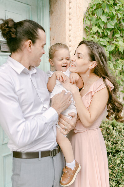 A family laughing together in West Palm Beach