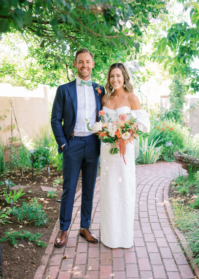 bride and groom laugh together at their wedding ceremony