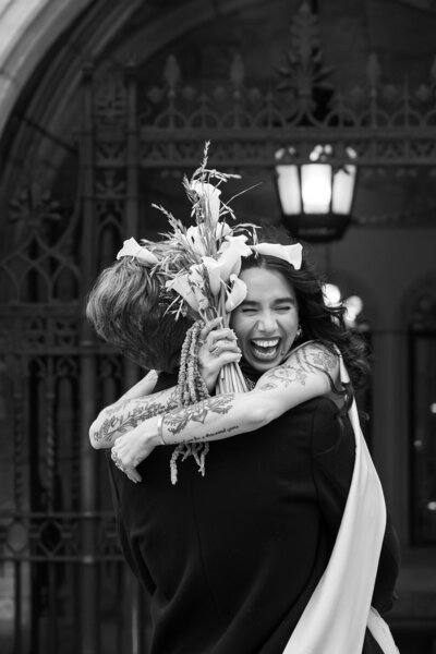joyful bride hugging groom