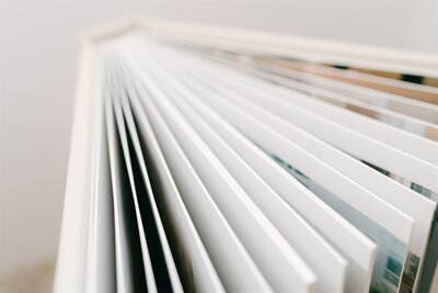 Close-up of a luxury wedding album with thick, high-quality pages, captured by Nashville wedding photographer Diana Marie.