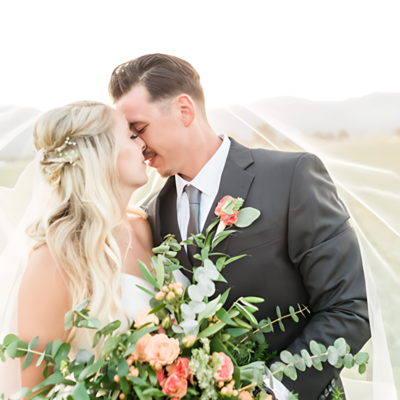 Bride and groom sharing a joyful moment together on their wedding day in Columbus, Ohio, captured in a beautiful outdoor setting.
