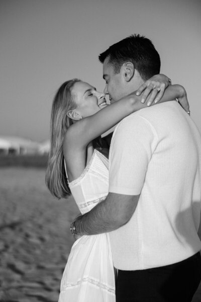 hamptons black and white photo of a couple on the beach