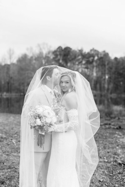 groom kissing brides head while under her veil on wedding day — Madison Abernathy Photo