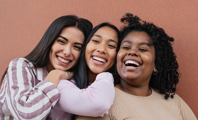 THree teen girls smiling and enjoying each other, learning to support each other