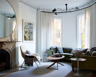 Interior Design Boston featured in Architectural Digest: a New England designer creates a Vermont living room with neutral furnishings and fine art.