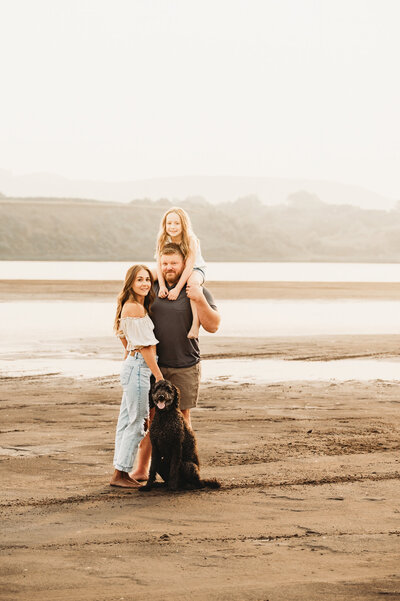 A family pauses to give a smile to Nikii Pix while enjoying splashing around the river near Bismarck, ND 