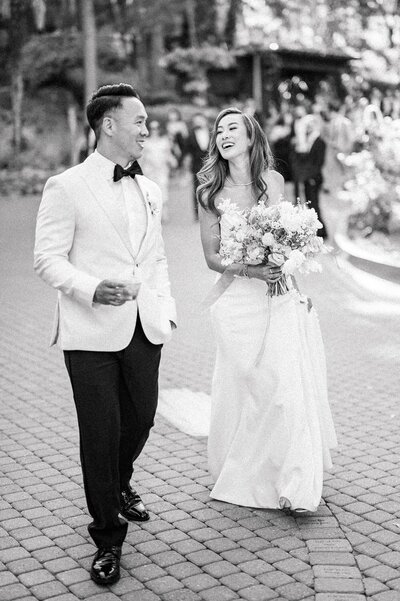 Bride and groom walk up memorial steps at their DC wedding