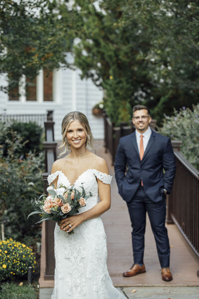 The English Manor Wedding | Bride Holding Bouquet as Groom Looks On Lovingly | Ocean Township, New Jersey