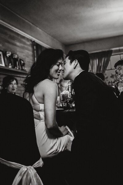 Black and white photo of couple kissing at Olympia Wedding
