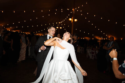 Couple entering the dance floor to celebrate with their friends and families