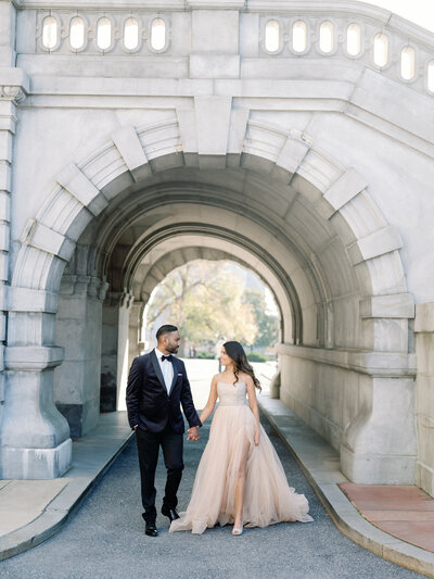 Bride and groom walk up memorial steps at their DC wedding