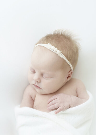 brunswick newborn photographer with a simple timeless approach in studio with family