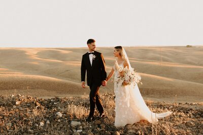 Golden Hour Couple Walking - Bre & Chris | Converted Basketball Court Wedding – Featured in Brides Magazine