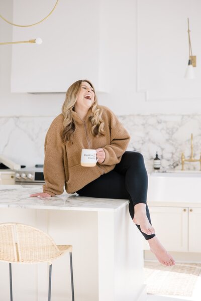 Carissa drinking coffee and laughing