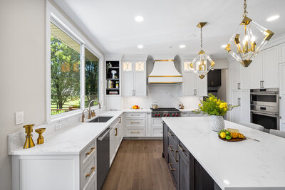 Bright white kitchen with dark wood accent cabinets