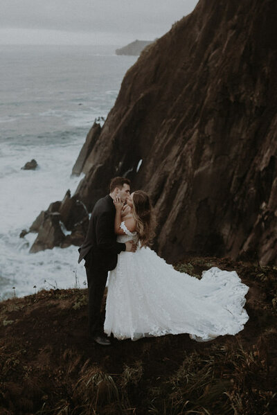 A couple having their elopement ceremony at Elk Flats trail in Oswald West State Park in Oregon.