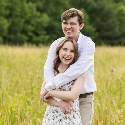 bride and groom smiling at each other