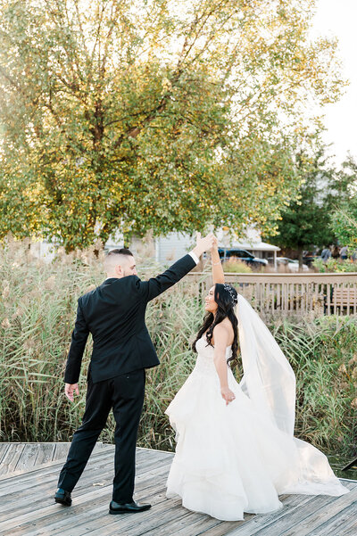Groom spinning bride