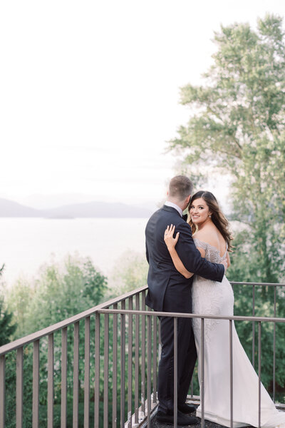 Bride and groom on a balcony outside in vancouver, canada