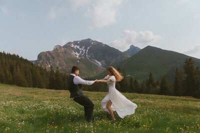 couple kissing in field