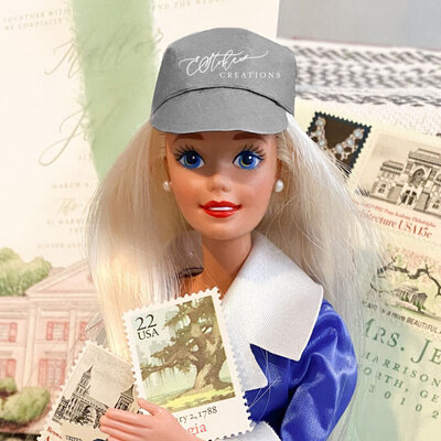 Pen-friend Barbie doll with E Stokes Creations branded hat, showcasing a vintage Georgia stamp