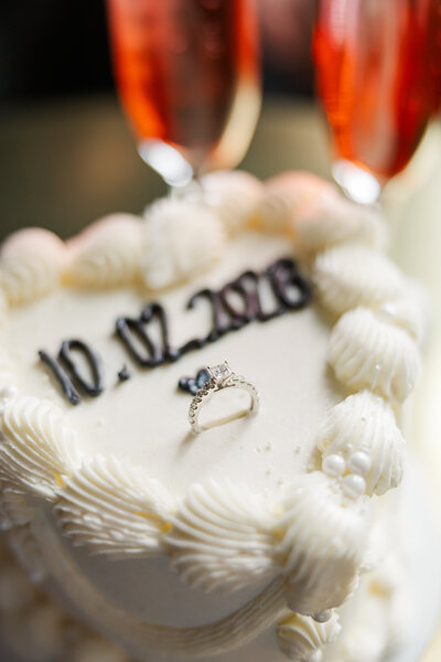 Engagement ring heart cake inspo in Omaha, NE photographed by Claire Katan Creative. Engagement announcement cake photography  by Claire Katan.