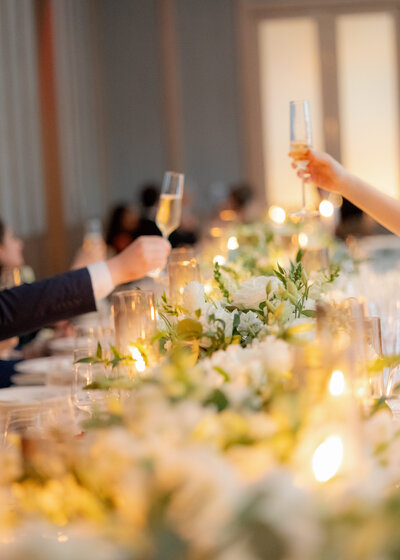 Green and white table setting with candles