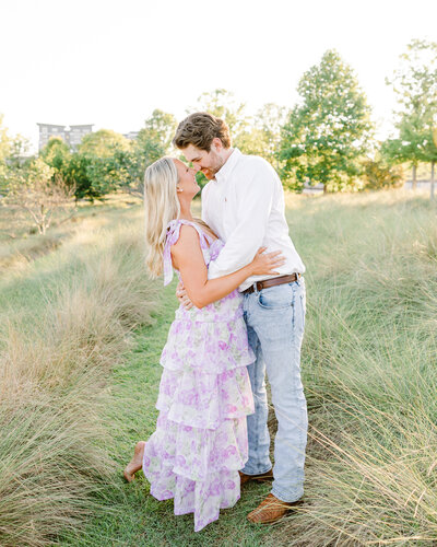 Romantic engagement session by Abby Bell Photography, Alabama's luxury wedding and portrait photographer, capturing a couple's joyful connection in a fine art style. Specializing in timeless and personalized engagement photography in Alabama.