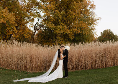 Bride and groom kissing on wedding day