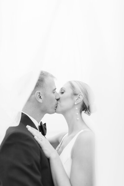 Black and white wedding veil kiss photo at Epping Forest Yacht Club in Jacksonville Florida