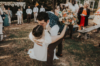 groom dips bride