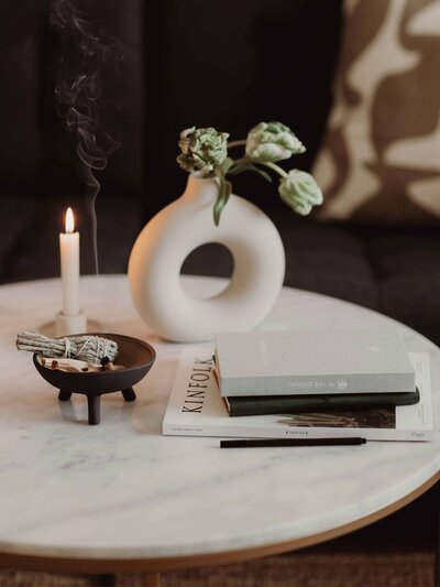 Candles and books on a table