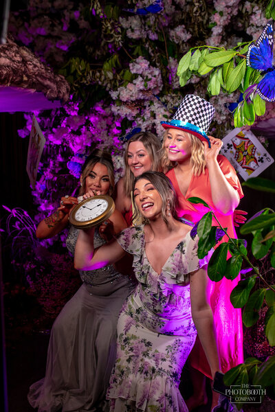 Corporate event team using branded photo booth for social media engagement