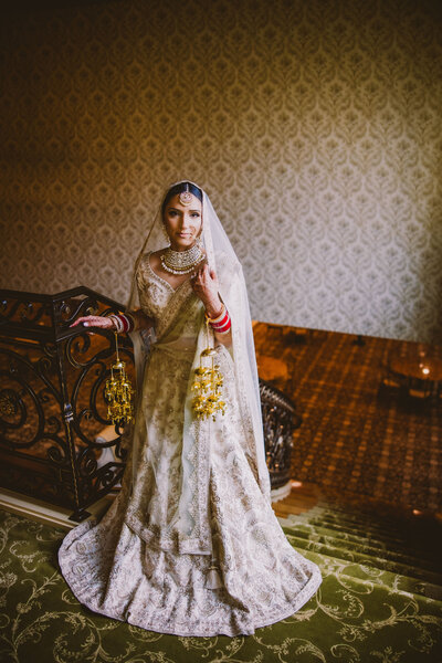 A sikh bride on the stairs inside the Brigalias in nj